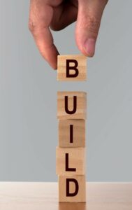Wooden blocks in a vertical formation making the word build