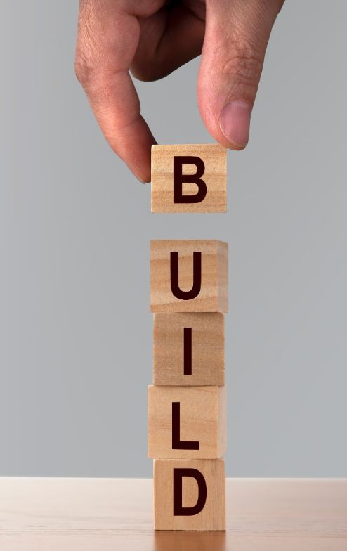 Wooden building blocks spelling out the world 'build'